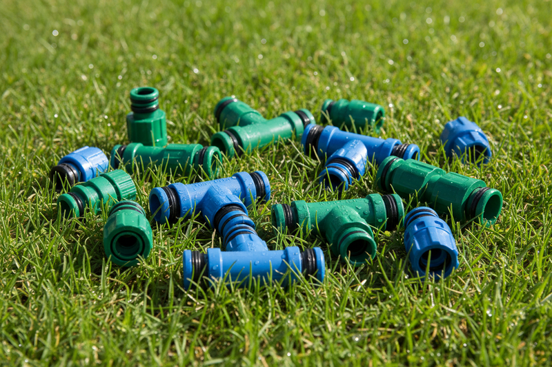 plastic hose pipe adapters and connectors on grass