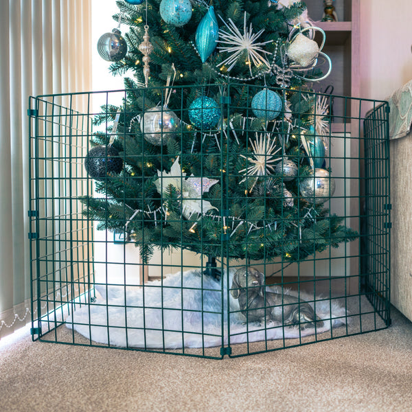 Conka Christmas tree protector fence panels around a decorated tree
